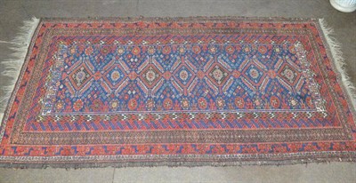 Lot 559 - Balouch rug, Persian/Afghan Frontier, the mid indigo field with a column of serrated guls...