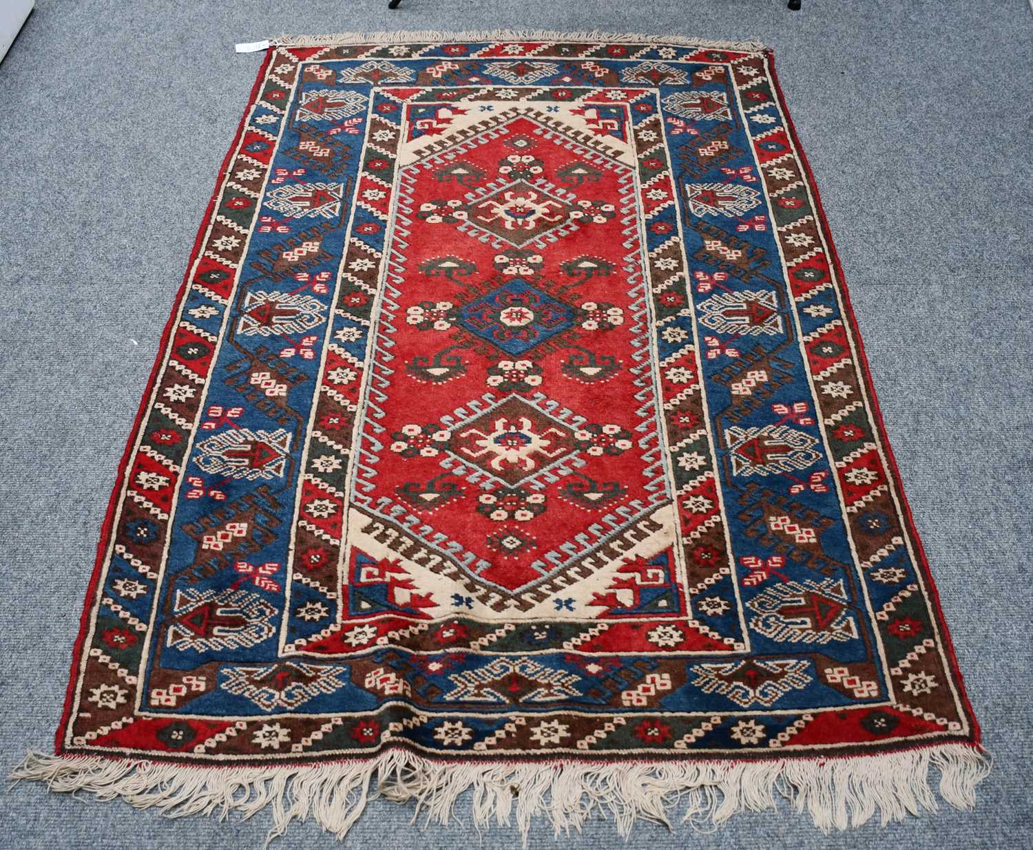 Lot 1015 - A Dosemealti rug, the raspberry field with...