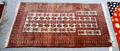Lot 1016 - A Beluch prayer rug, the cream field with tree...