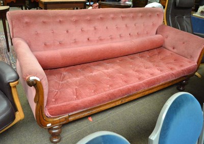 Lot 562 - A 19th century rosewood framed settee with button back velvet upholstery