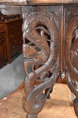 Lot 1124 - A Burmese carved hardwood table, decorated...