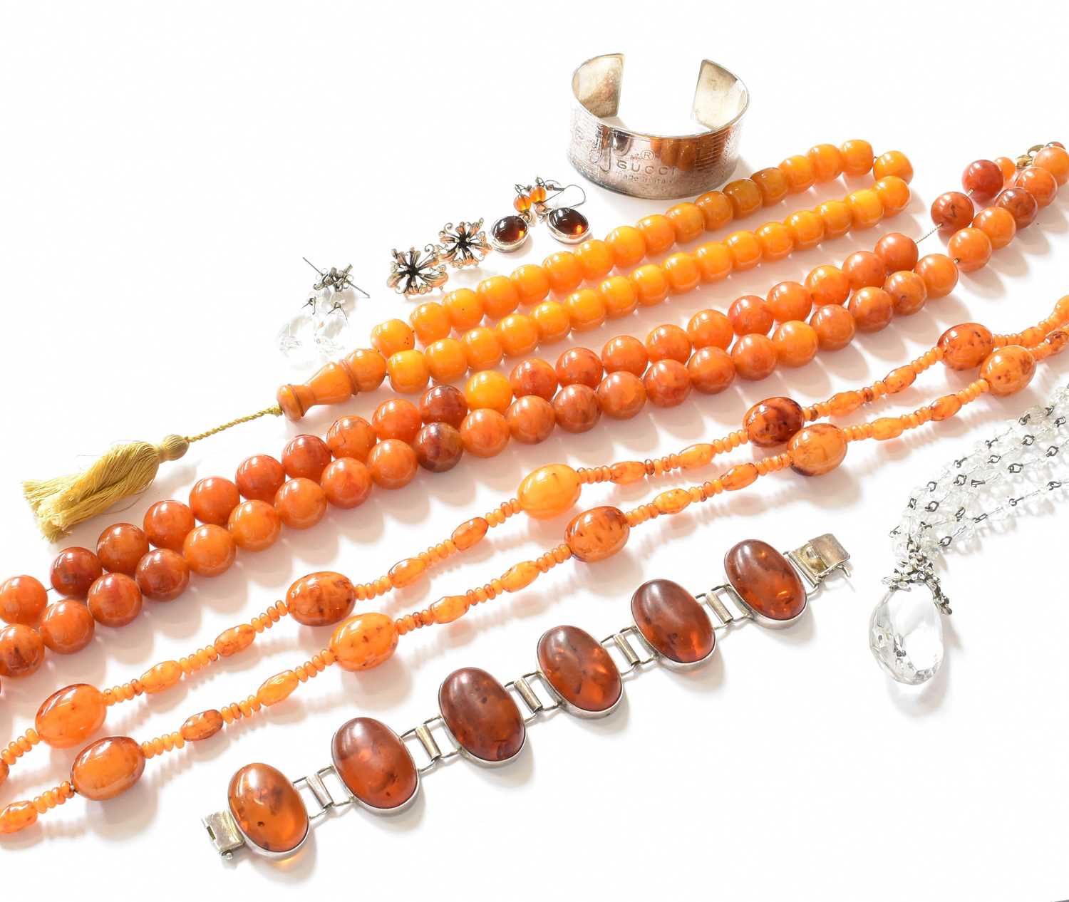 Lot 201 - A small collection of amber and amber type...