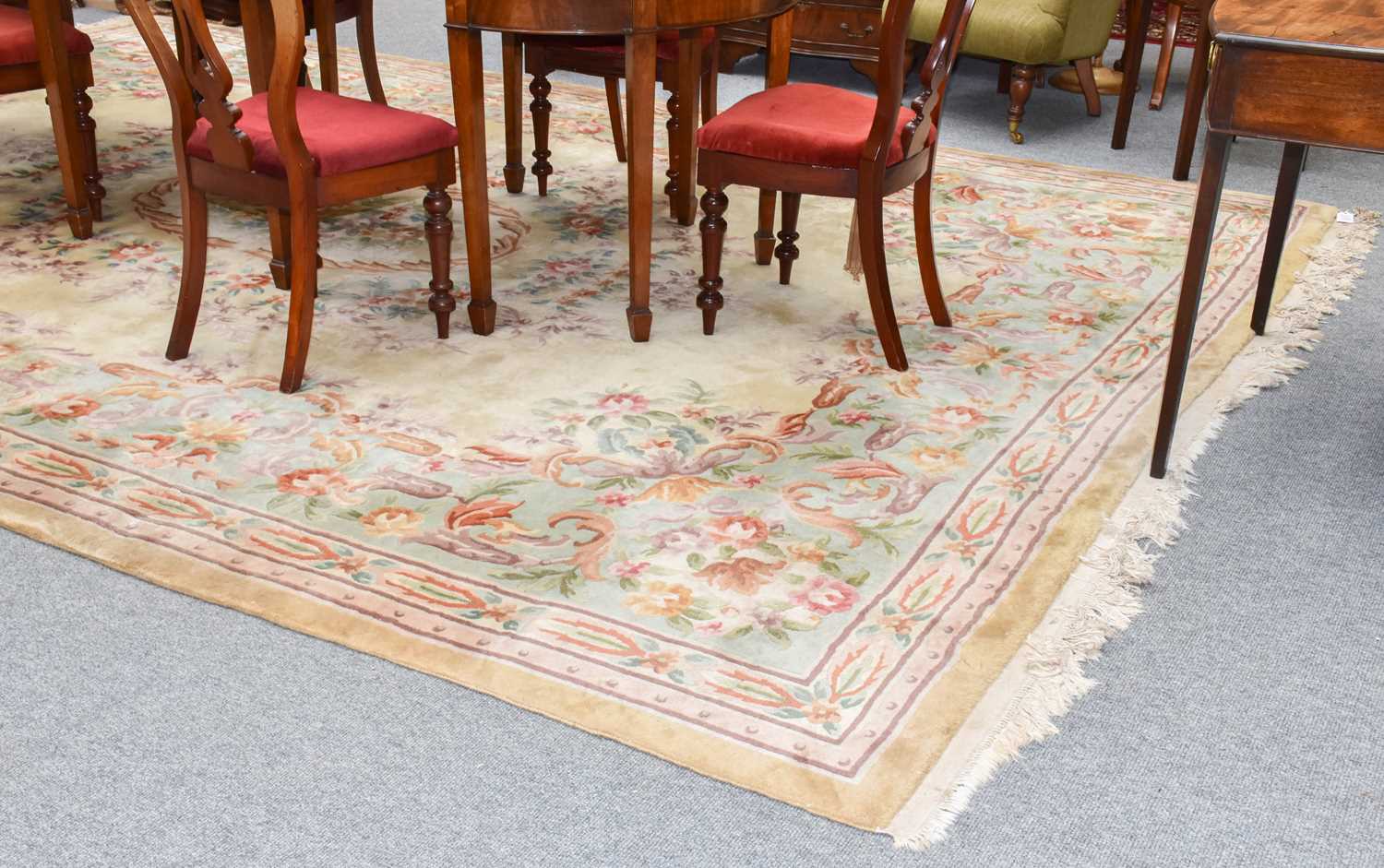 Lot 1008 - A Chinese Savonnerie style carpet, the pale...
