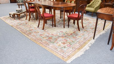 Lot 1008 - A Chinese Savonnerie style carpet, the pale...