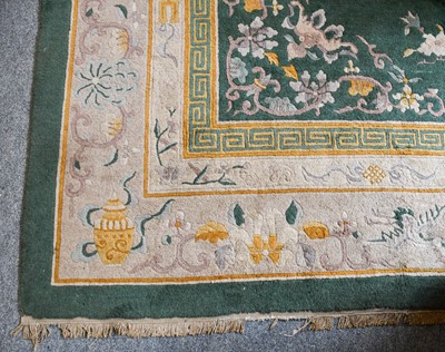 Lot 1009 - A Chinese carpet, the apple green field of...