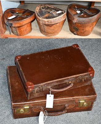 Lot 1325 - Three vintage leather hat boxes, together with...