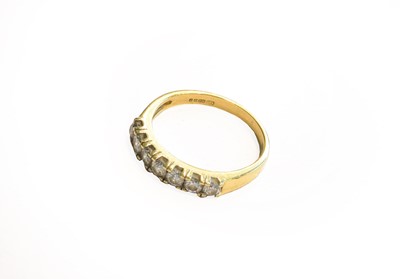 Lot 254 - An 18 carat gold diamond seven stone ring,...