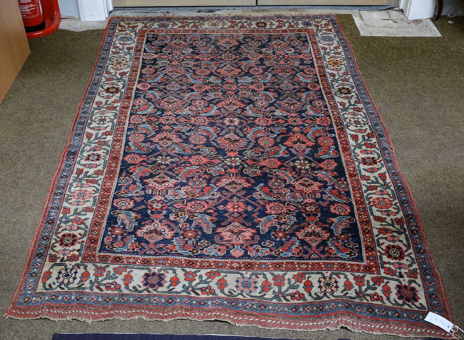 Lot 1005 - A Bidjar rug, the indigo field of Herati...