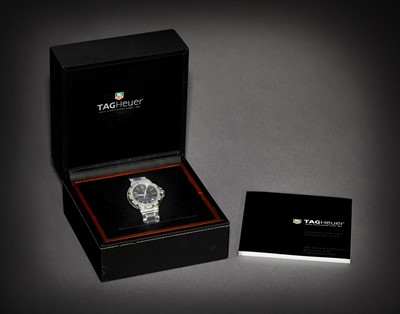 Lot 2167 - Tag Heuer: A Lady's Stainless Steel Diamond Set Calendar Centre Seconds Wristwatch
