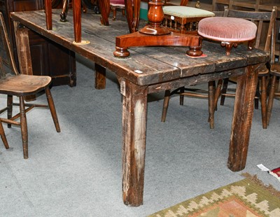 Lot 1203 - A provincial plank top table (distressed,...