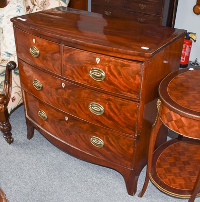 Lot 1173 - A George III mahogany bow front chest of two...