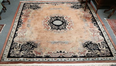 Lot 1128 - A Chinese Carpet, the pail peach field centred...