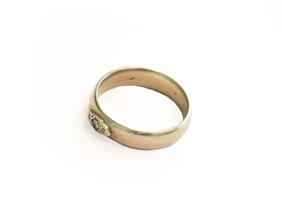 Lot 268 - A diamond three stone ring, stamped '14K',...