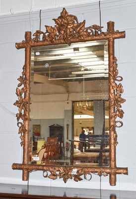 Lot 1215 - A 19th century gilt-framed mirror applied with...