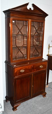 Lot 1105 - An Edwardian mahogany secretaire bookcase,...