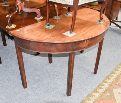 Lot 1116 - A George III mahogany d end dining table, with...