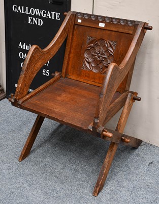 Lot 1277 - An oak Glastonbury chair, the back rest with...