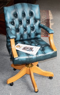 Lot 1137 - Swivel blue leather button office arm chair...