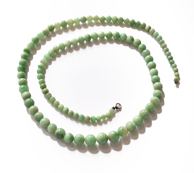 Lot 199 - A graduated jade bead necklace, length 65cm