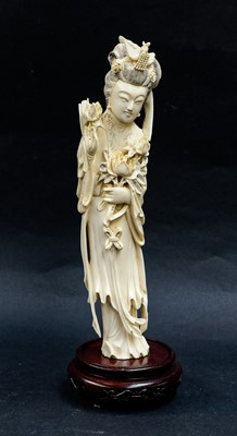 Lot 295 - A 19th century Chinese carved ivory figure of...