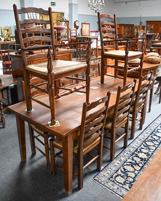 Lot 1191 - A set of eight oak ladderback dining chairs,...