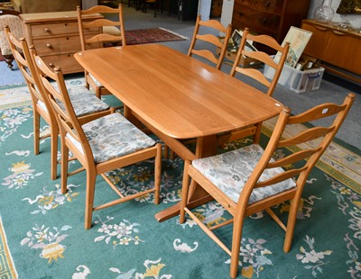 Lot 1261 - A light Ercol refectory dining table, 152cm by...