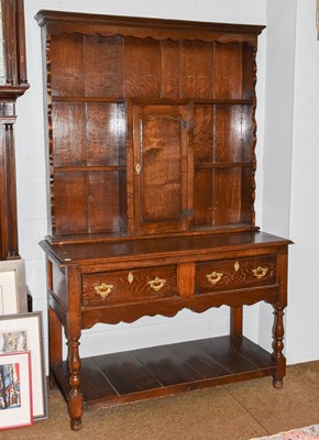 Lot 1196 - An early 20th century oak dresser and rack...