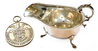 Lot 26 - A silver sauceboat, Chester.1932 and a London...