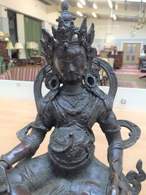 Lot 150 - A Sino-Tibetan bronze figure of Vaisravana,...