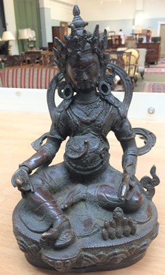Lot 150 - A Sino-Tibetan bronze figure of Vaisravana,...