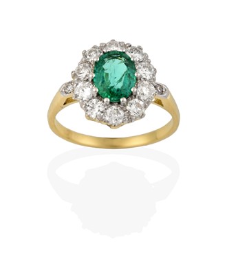 Lot 2296 - An Emerald and Diamond Cluster Ring