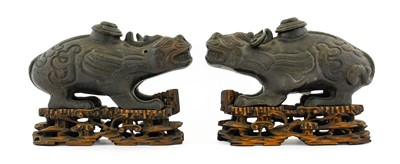 Lot 199 - A Pair of Chinese Bronze Mythical Beasts, in...