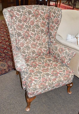 Lot 1258 - A Victorian armchair on turned mahogany legs,...