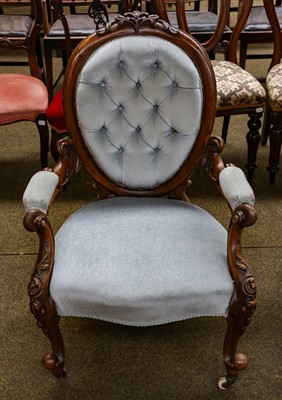 Lot 1264 - A Victorian carved walnut open armchair