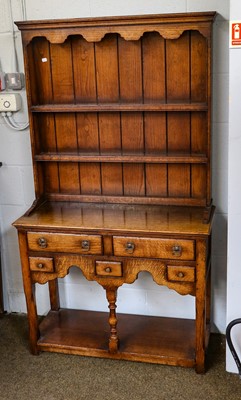 Lot 1204 - A small 20th century oak dresser and rack with...
