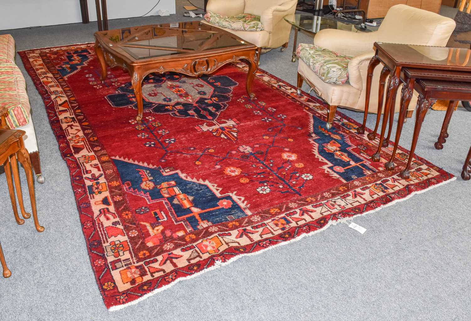Lot 1004 - A Kurdish carpet, the crimson field centred by...