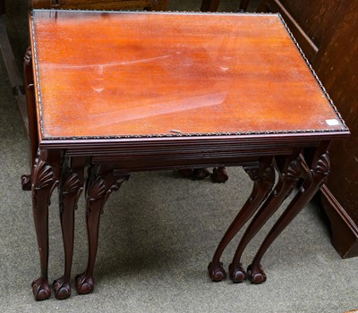 Lot 1124 - A nest of tables on claw and ball feet