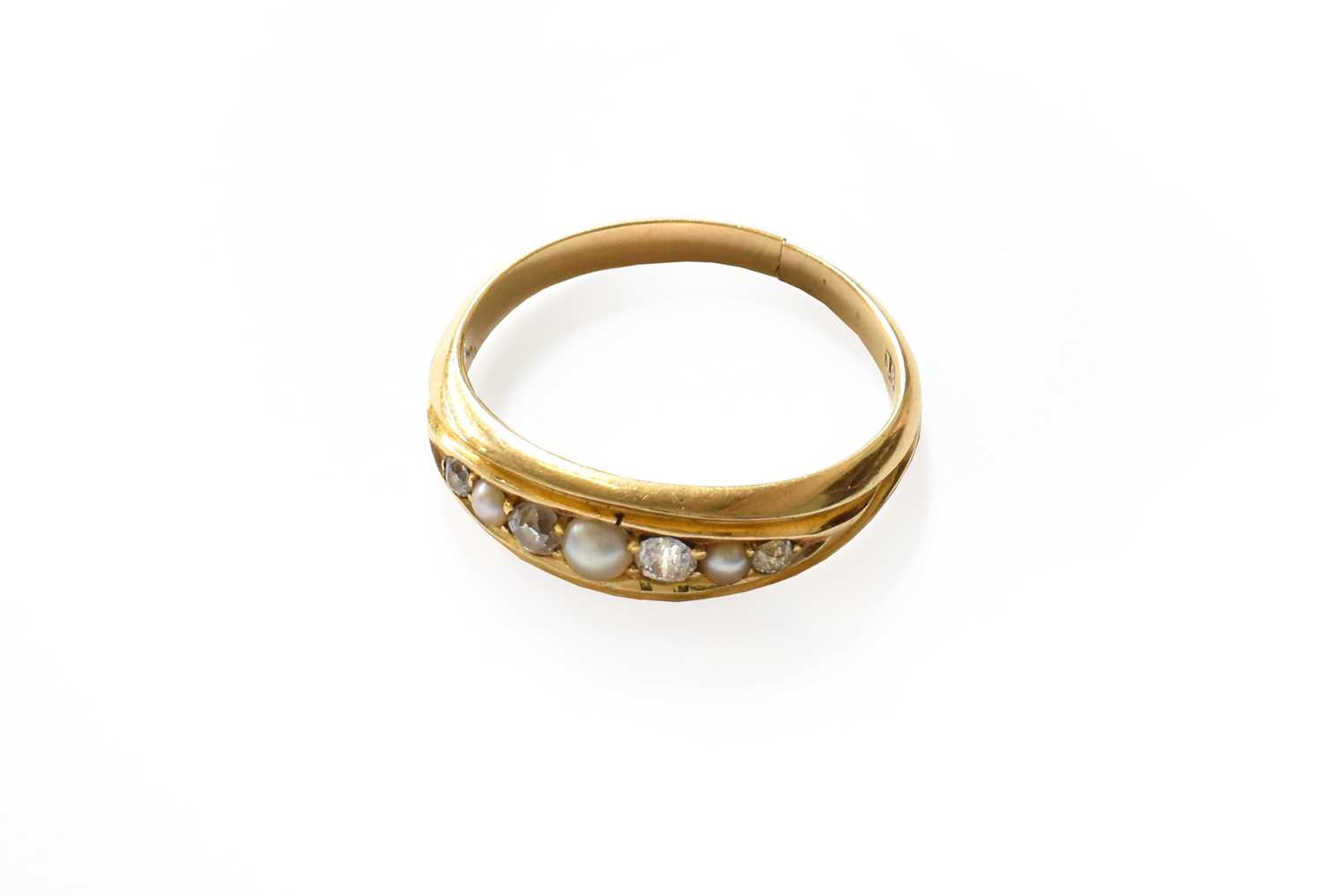 Lot 218 - A split pearl and diamond ring, stamped '18'...
