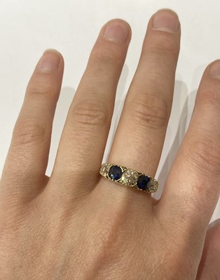 Lot 2304 - A Sapphire and Diamond Five Stone Ring