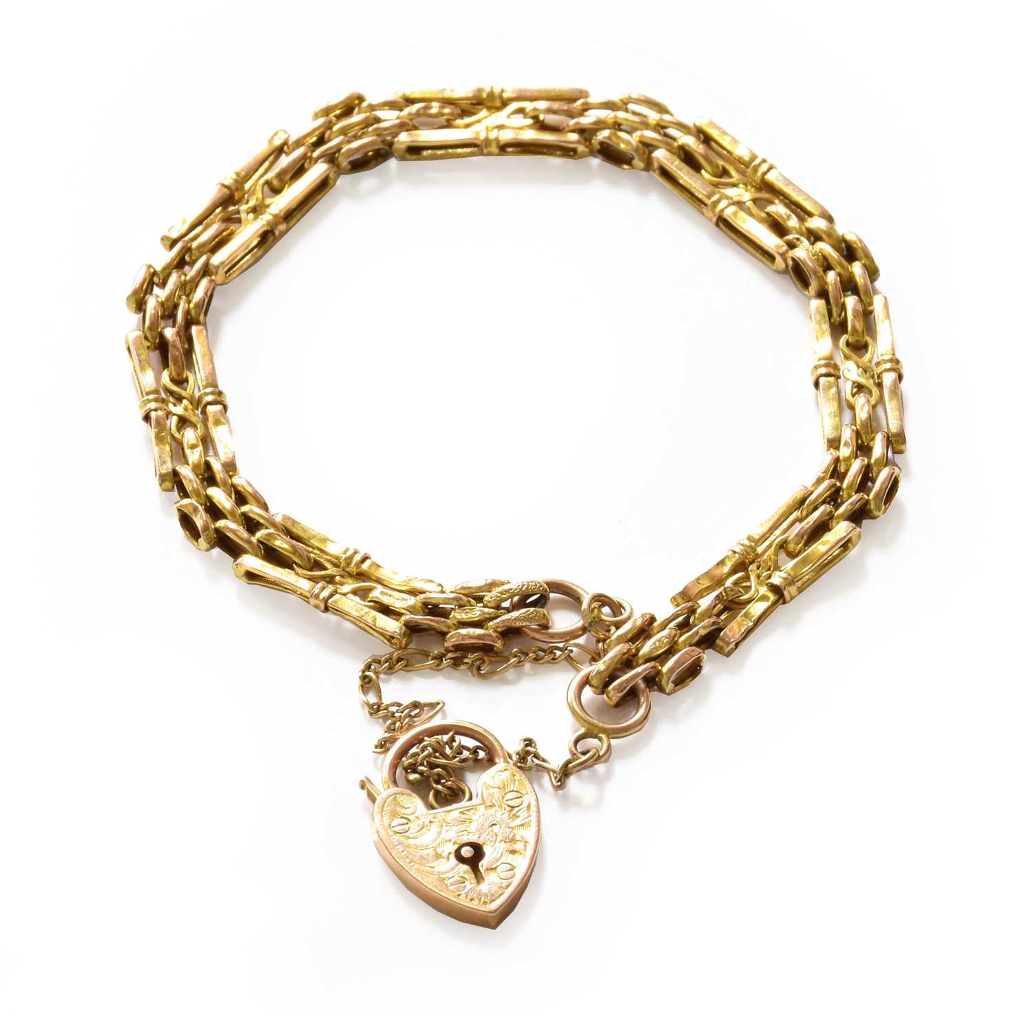 Lot 206 - A gate link bracelet with heart-shaped padlock...