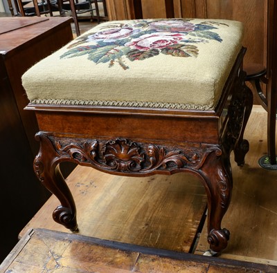 Lot 1230 - A Victorian carved walnut stool, with...