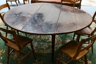 Lot 1169 - An 18th century oak drop leaf dining table...