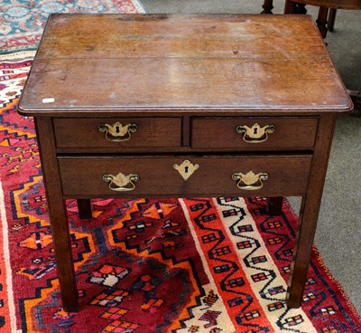 Lot 1251 - A George III oak three-drawer low bow, with...