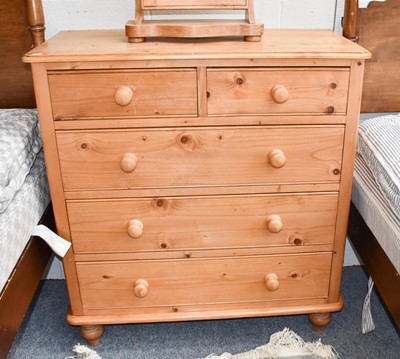Lot 1162 - A modern pine four height chest of drawers,...