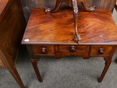 Lot 1234 - A 19th century mahogany three drawer table...