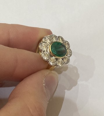 Lot 2353 - An Emerald and Diamond Cluster Ring