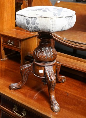 Lot 1165 - A Victorian leaf carved revolving piano stool