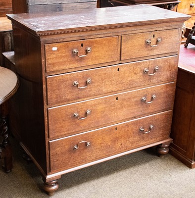 Lot 1247 - A George III oak chest of two short over three...