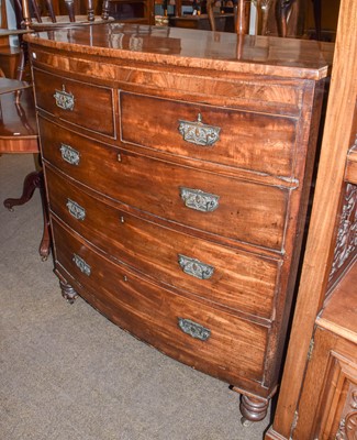 Lot 1300 - An early 19th century mahogany bow front chest...