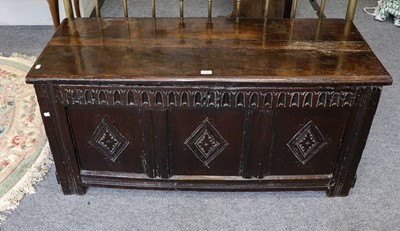 Lot 1161 - A Charles II oak three panel coffer with...